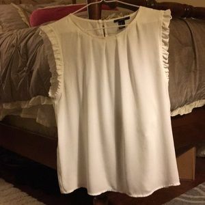 A beautiful blouse with ruffles on the sleeves